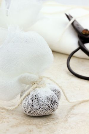 Muslin bag filled with herbs for tea or spices for a garni bag.の写真素材