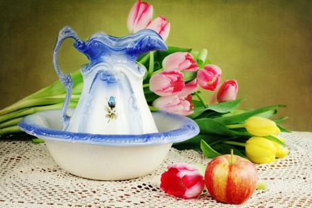 Antique pitcher and basin with fresh cut tulips.