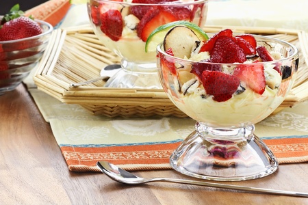 Freeform strawberry cheesecake with cookies and a slice of lime. Shallow depth of field. の写真素材