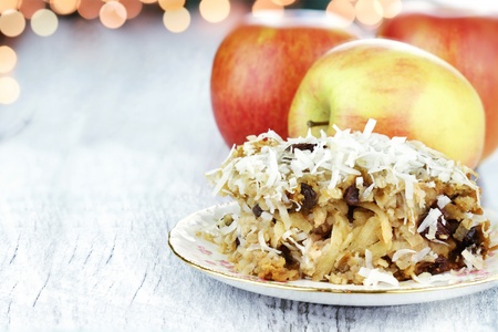 Apple casserole made of shredded apples, oats, coconut and raisins. Shallow depth of field with room for copy space. の写真素材