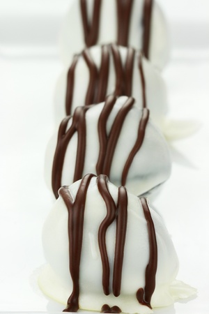 White chocolate truffle candies. Shallow depth of field with selective focus on first truffle.の写真素材