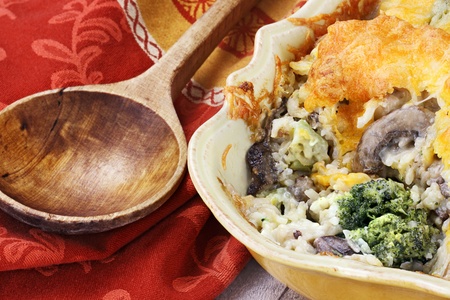 Cheesy broccoli casserole made with cheddar cheese, broccoli, portabella mushrooms and rice.の写真素材