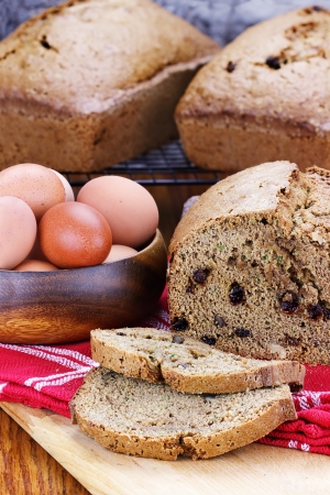 Freshly made and sliced zucchini bread with fresh eggs. 
の写真素材