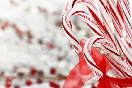 Candy canes in a glass dish with copy space.の写真素材