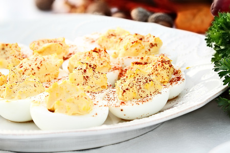 Deviled eggs with extreme shallow depth of field with selective focus on center of eggs.