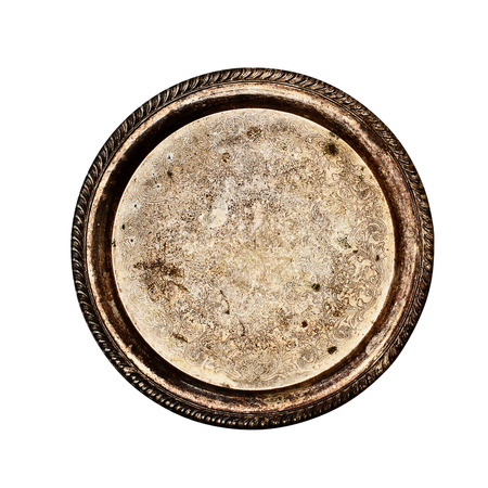 Vintage tarnished silver plate isolated with clipping path over a white background. Image shot from overhead.の写真素材