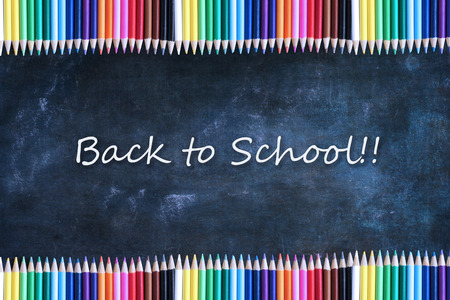 School chalkboard or blackboard and colored pencils with Back to School Text.の写真素材