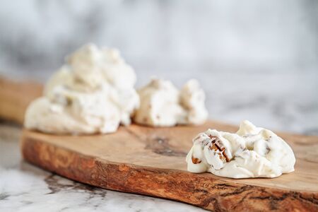 Keto butter pecan fat bombs. Made with pecan nuts, coconut oil and butter. .Selective focus with blurred background. Ketogenic diet conceptの写真素材