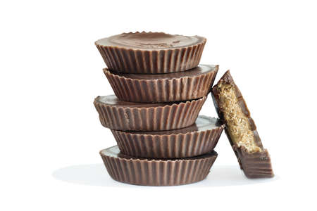 Chocolate peanut butter cup candy isolated over a white background with light shadow. Clipping path included.の写真素材