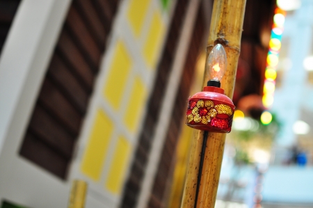 Red Oil Lamp Hanging on Village House During Hari Rayaの写真素材