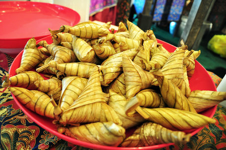 Ketupat Palas in a plate ready to be served for buka puasa dinnerの写真素材