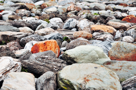 Nice scenery at Taiwan seaside with big rocks and pebbles, cloudy blue sky