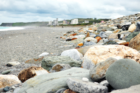 scattered rocks along beach lineの写真素材
