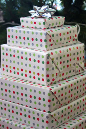 stack of presents wrapped in polka dot paperの写真素材
