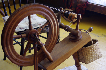 Old fashioned wooden spinning wheelの写真素材