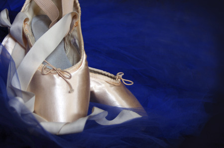 new pink ballet Pointe shoes with blue tutu on blackの写真素材