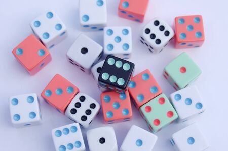 different colored dice on white backgroundの写真素材