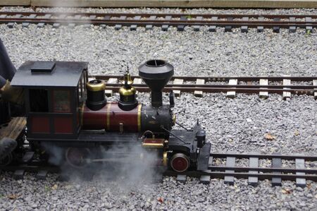 miniature steam train engine on tracks