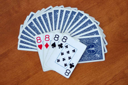blue playing cards displayed in fan with all 8 cards face up