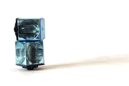 close up of old square vintage film camera flashcubes on white with copy spaceの写真素材