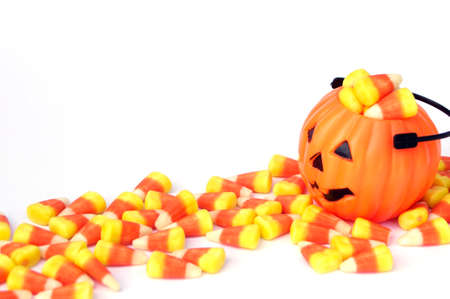 mini jack-o-lantern with Halloween candy cornの写真素材