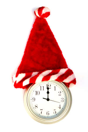 silver clock showing 12 with Christmas Santa hat onの写真素材