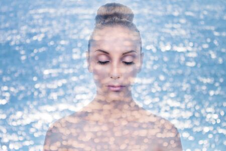 Double exposure of woman with water for skin moisturizer conceptの写真素材