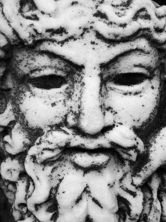 Close up of a granite carved faceの写真素材