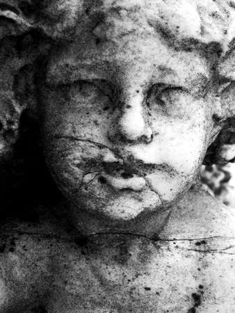 Close up of a granite carved faceの写真素材