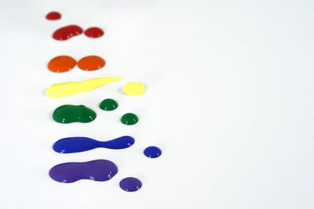 Primary colored paint splatters on whiteの写真素材