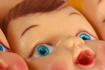 A close up of a plastic doll face の写真素材