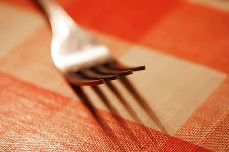 Close up of a fork on a picnic table with shallow DOFの写真素材