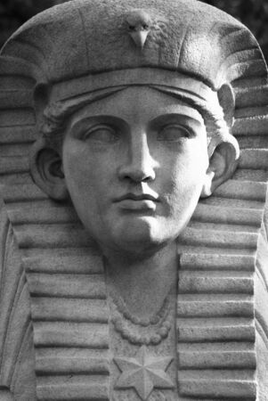 Portrait of an Egyptian deity carved in stoneの写真素材