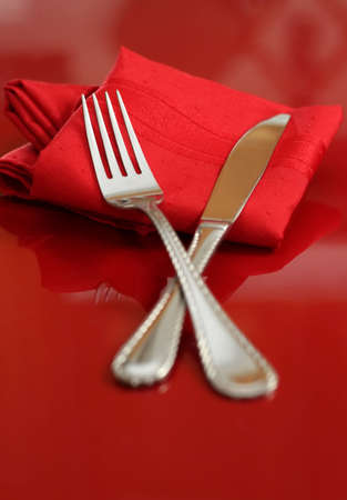 An elegant holiday table setting in red and whiteの写真素材