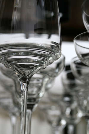 A row of wine galsses on in a bar