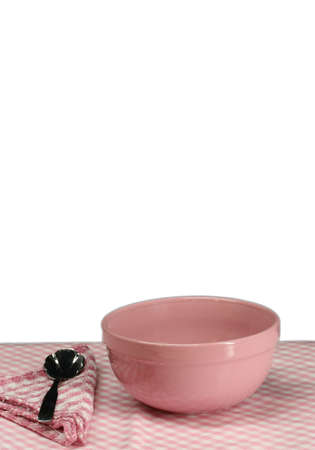 A pink picnic table setting with a white backgroundの写真素材