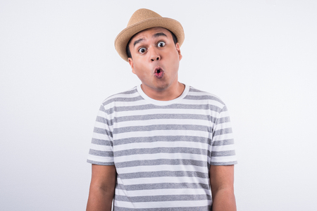Shocked face of asian young manの写真素材