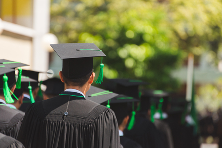 Rear view of Graduates join the graduation ceremony at the university. Education concept.の写真素材