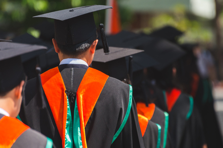 Rear view of Graduates join the graduation ceremony at the university. Education concept.の写真素材