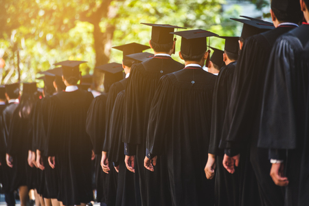 Rear view of Graduates join the graduation ceremony at the university. Education concept.の写真素材