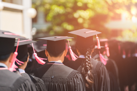 Rear view of Graduates join the graduation ceremony at the university. Education concept.の写真素材