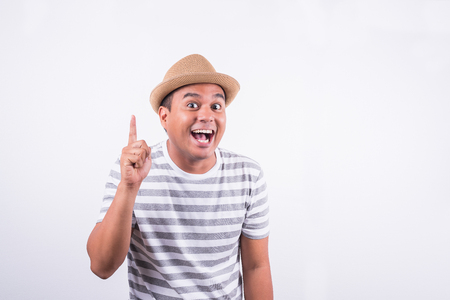 Happy asian man thinking on isolate. Idea concept.の写真素材
