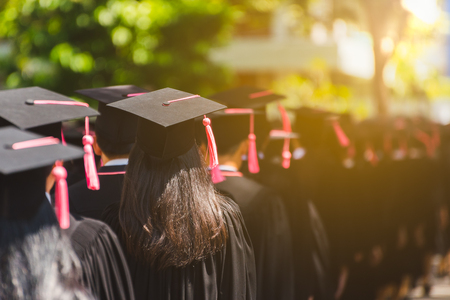 Rear view of Graduates join the graduation ceremony at the university. Education concept.の写真素材