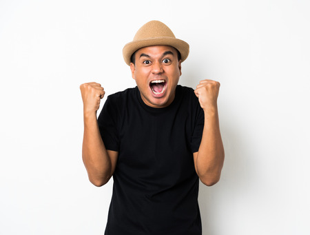 Asian man is feeling happy on white background.の写真素材