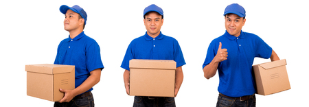 Young asian delivery man in blue uniform with parcel cardboard box on isolatedの写真素材