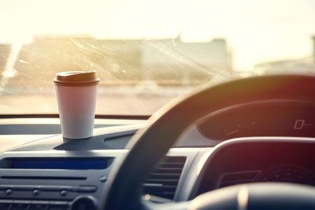 Coffee paper cup in car