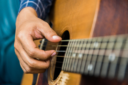 Close up left hand of guitar playerの写真素材