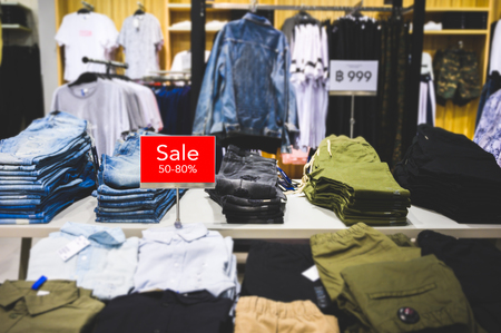 Sale 50-80% off mock up advertise display at clothes line in the shopping department store. Shopping concept.の写真素材
