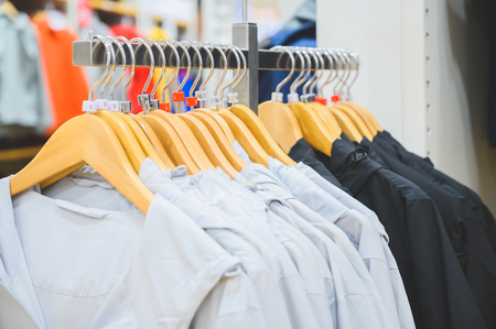 Colourful shirts on the hanger at shopの写真素材