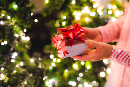 Hands holding gift box. Happiness, Christmas or new year  concept.の写真素材